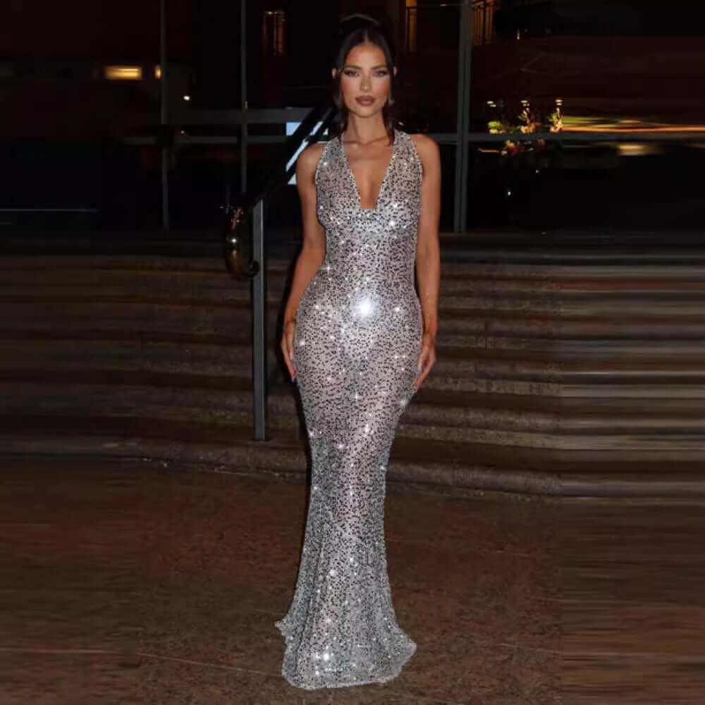 White halter backless cloth dress with high waist umbrella skirt and sequin details